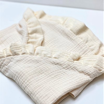 Arrullo de muselina con volante